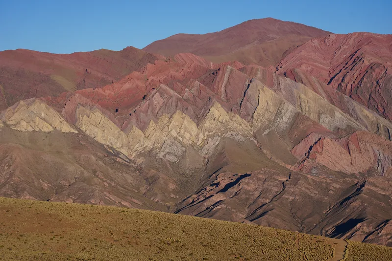A polychromatic geological formation in the Argentine Altiplano — almost certainly the Serranía de Hornocal or a compara