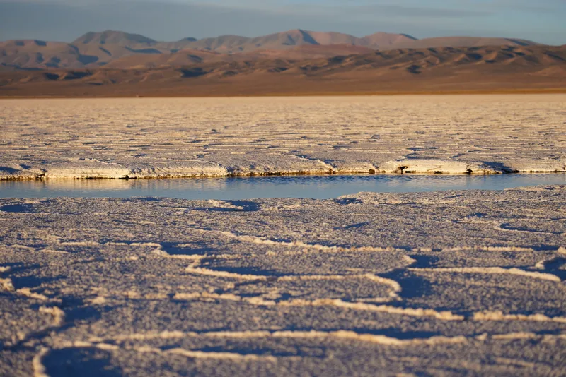 A salt flat — likely the Salinas Grandes or Salar de Atacama region of northwestern Argentina or the Chilean altiplano —
