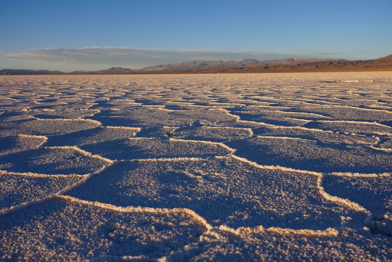 A salt flat — most likely the Salar de Uyuni in Bolivia or a comparable Andean salt pan — photographed at extreme close 