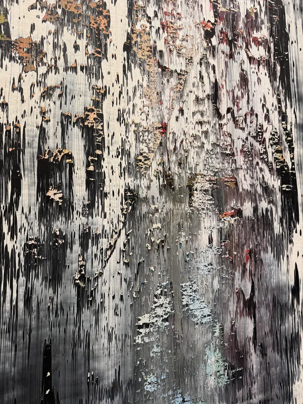 Heavily weathered, painted wooden or metal surface — multiple paint layers exposed through peeling, dripping, and erosio