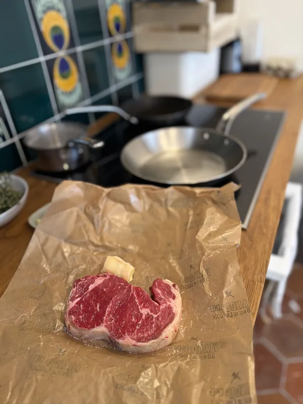 Back in the city, the steak unwrapped on butcher paper. The weekend closes on something specific and perishable.