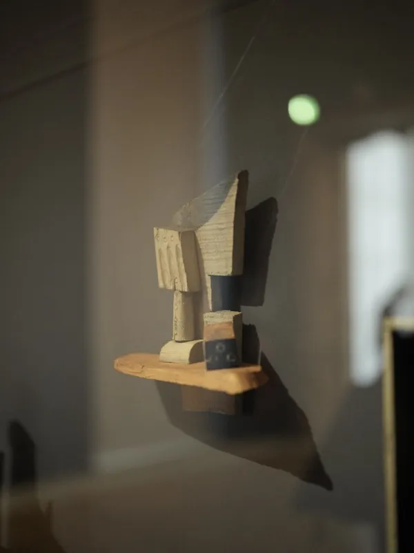 A small Cubist assemblage sculpture, almost certainly a Picasso maquette — constructed from wood scraps, cardboard, and 
