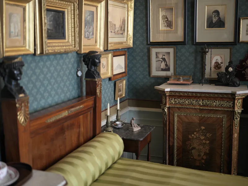 A 19th-century furnished interior, likely a preserved historic room in a museum or private house, viewed from a low angl