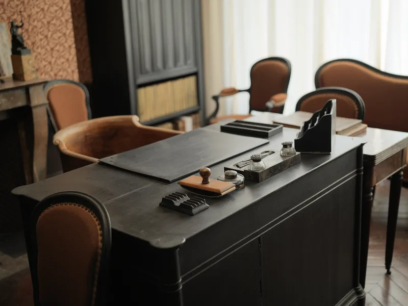 A 19th-century writing desk in what appears to be a preserved historical interior — likely a museum house or heritage si