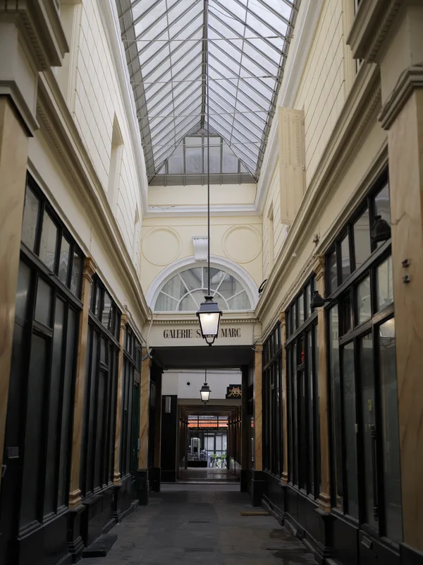 The Galerie Saint-Marc, one of the covered passages of Paris, photographed at opening hours in the absence of foot traff
